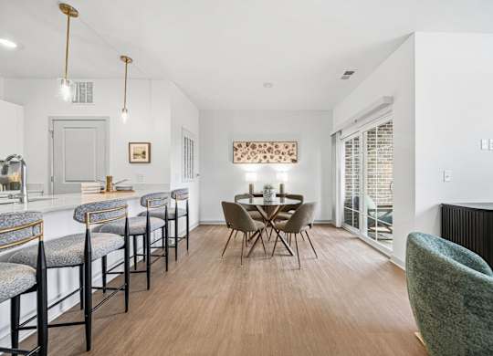 A dining area with a table set for four.