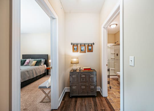 a living room with luggage on the floor and a staircase
