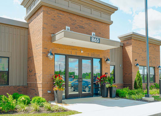 the front of a building with glass doors