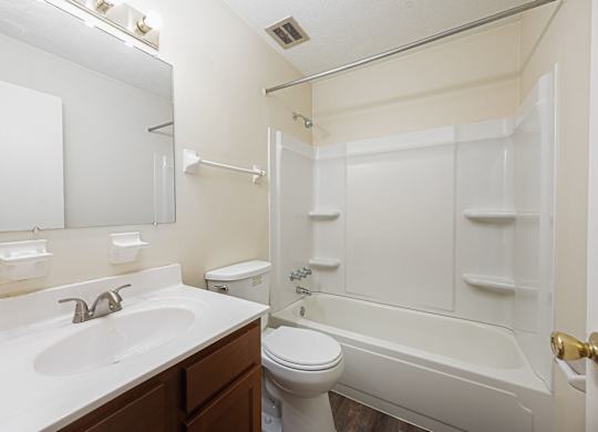 a bathroom with a sink toilet and a bath tub