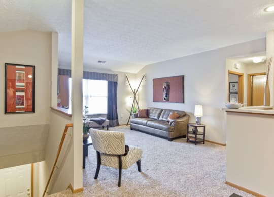 a living room with a couch and a chair