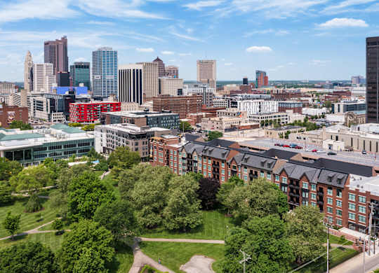 an aerial view of the city with buildings and trees