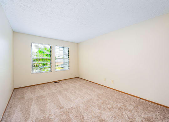 a room with carpet and a window