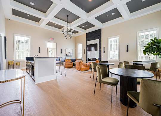 A large room with a white table and chairs.