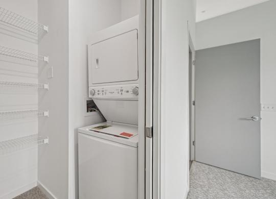 A white dishwasher is open in a kitchen.