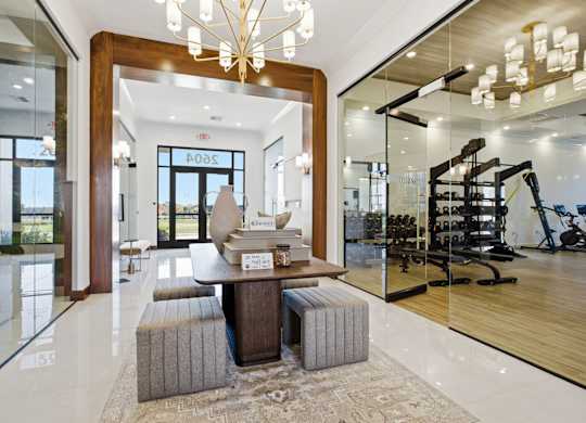 A modern living room with a wooden coffee table and a chandelier.