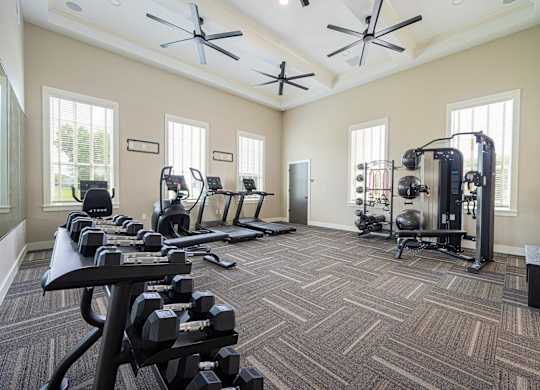A spacious home gym with a variety of exercise equipment.
