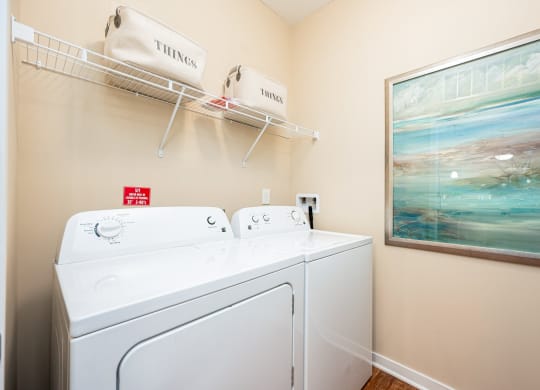a washer and dryer in the laundry room of a rental home
