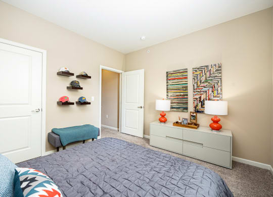 a bedroom with a bed and a closet