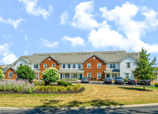 a large building with cars parked in front of it