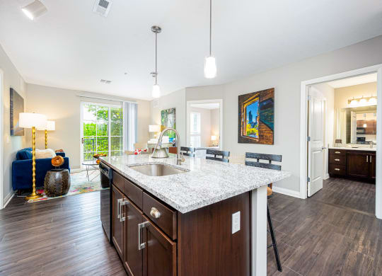 a kitchen with a granite counter top and a sink