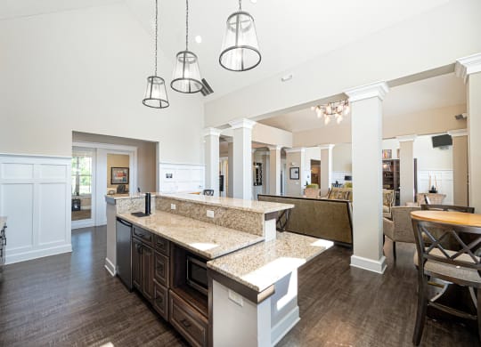 a large kitchen with a large island in the middle