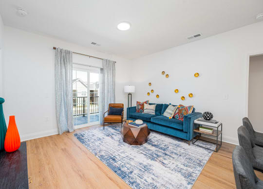 a living room with a blue couch