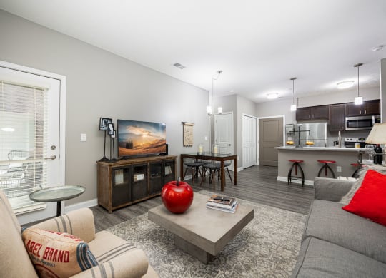 a living room with a couch and a table with a television