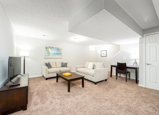 a living room with a couch and a table