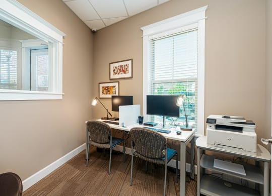 a home office with a desk and a computer
