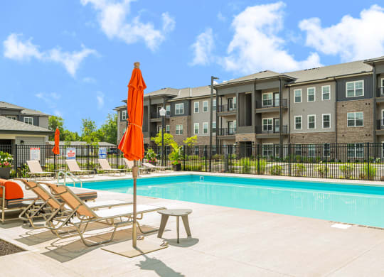our apartments offer a swimming pool with chairs and umbrellas