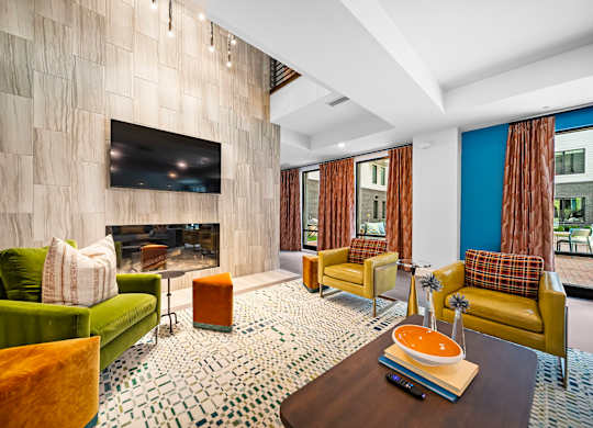 A living room with a fireplace and a television.