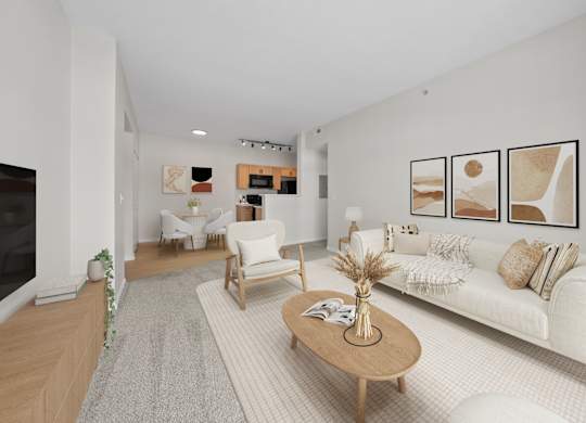 A living room with a white couch, a coffee table, and a fireplace.