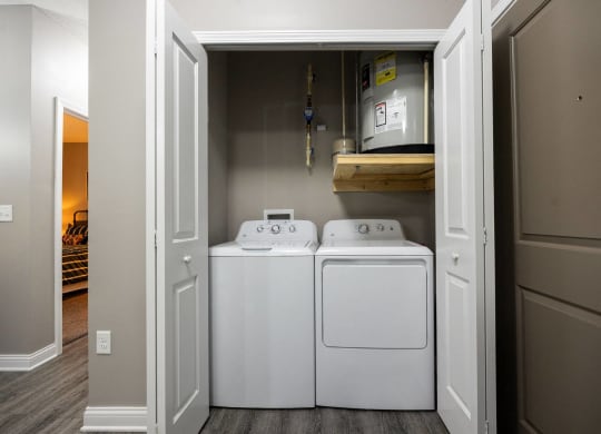 a laundry room with two washes and a dryer in it