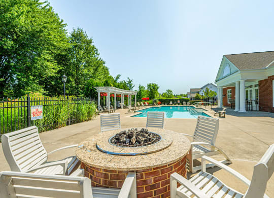 the preserve at ballantyne commons pool and patio with chairs and a fire pit