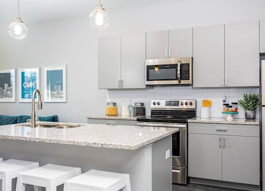a kitchen with stainless steel appliances and granite counter tops