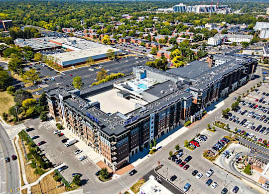 A large building with a parking lot in front of it.