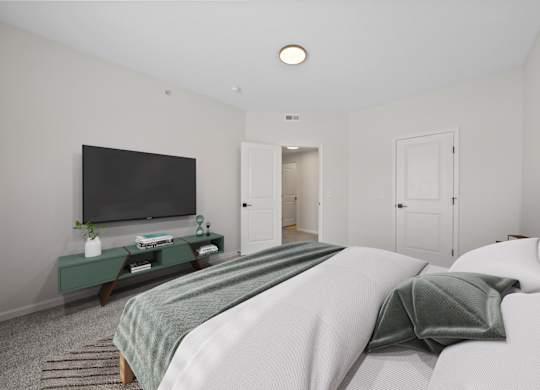 A bedroom with a bed, a television, and a cabinet.