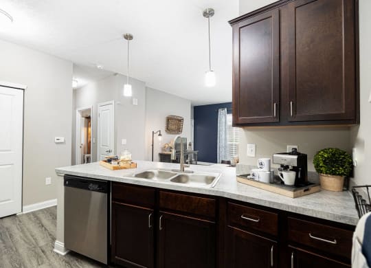 spacious kitchen with stainless steel appliances at the district flats apartments in lenexa