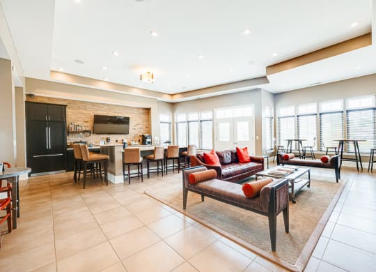 a living room with a couch and a table with chairs