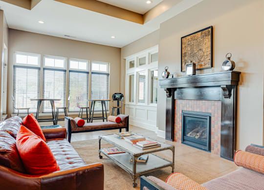 a living room with a fireplace and couches