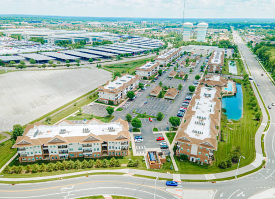 an aerial view of a city with buildings and a parking lot