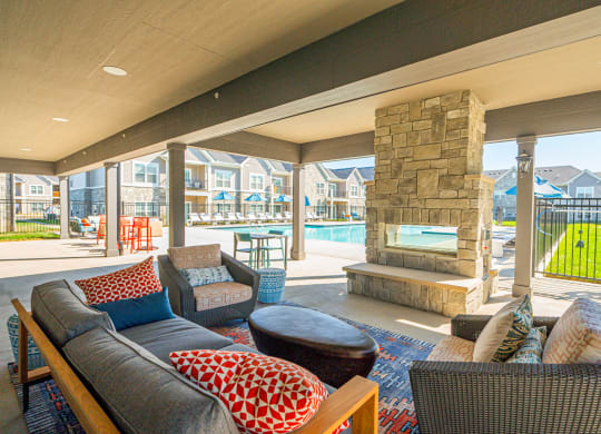 a living room with a fireplace and a pool