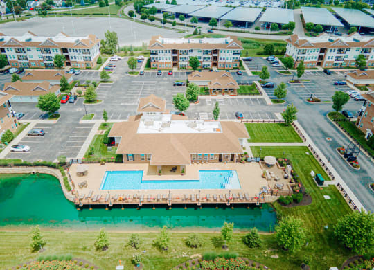 an aerial view of a large swimming pool in a parking lot