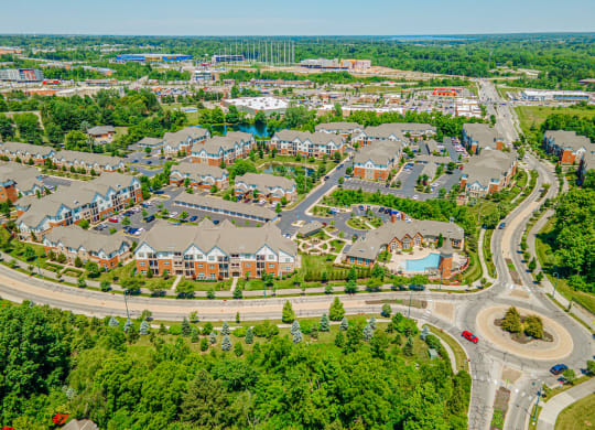 an aerial view of a suburb of a city with houses and roads