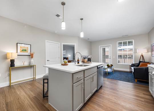 A kitchen with a white countertop and a white fridge.