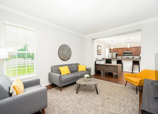 a living room with couches and a table