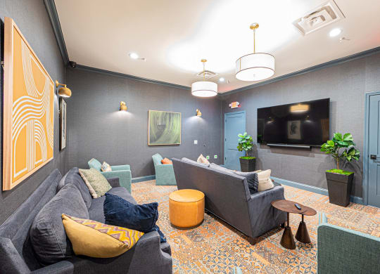 a living room with couches and a tv