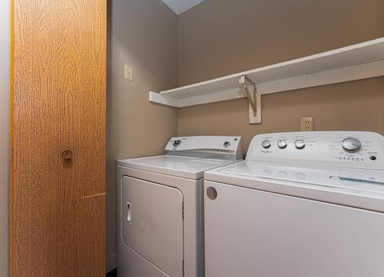 A laundry room with a washer and dryer.