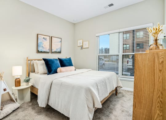 a bedroom with a large bed and a large window