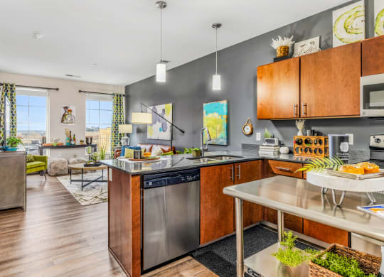 a kitchen with stainless steel appliances and a counter top