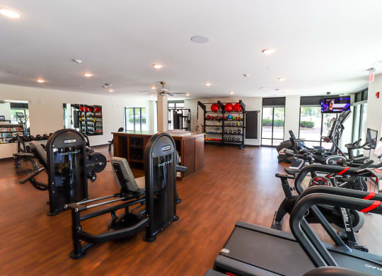 a room filled with lots of different types of exercise equipment