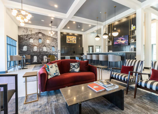 a living room with couches and chairs and a table