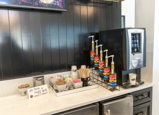 a kitchen counter with a tray of food and a coffee machine