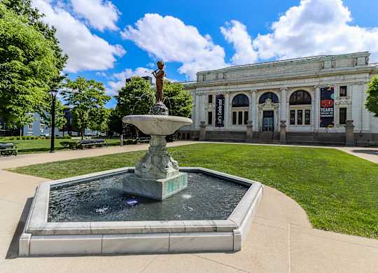 a fountain in front of a building campus
