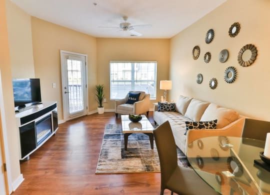 a living room with a couch and a table and a television