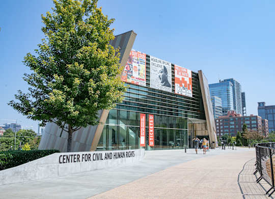 The Center for Civil and Human Rights building has a tree in front of it.