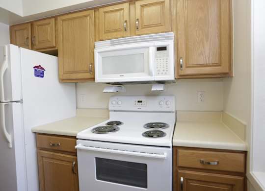 a kitchen with a stove microwave and refrigerator