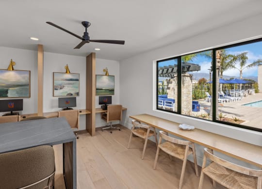 a living room with a table and chairs and a large window at Westbury Apartments, Rancho Cucamonga, 91739