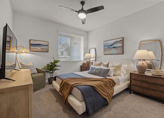 a bedroom with a bed and a ceiling fanat Westbury Apartments, Rancho Cucamonga, 91739